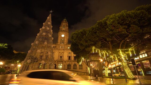 Night view of Porto Cathedral Sao with festive Christmas light projections.