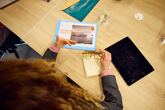 Anonymous woman reviewing project documentation