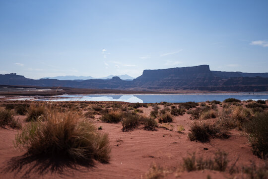Through a wire fence to the blue potash evaporation ponds near Moab