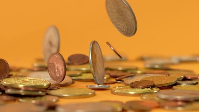 Shiny gold coins falling, financial saving grow concept of wealth banking investment economy success of finance business, monetization of ideas, abundance wealth prosperity motion.