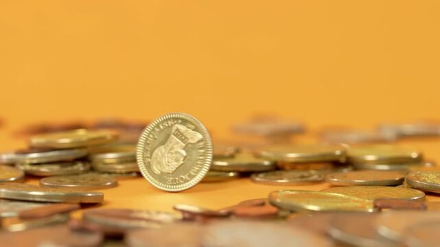 Golden coins rotating, twisting spinning penny, financial saving grow concept of wealth banking investment economy success of finance business, monetization of ideas abundance wealth prosperity motion