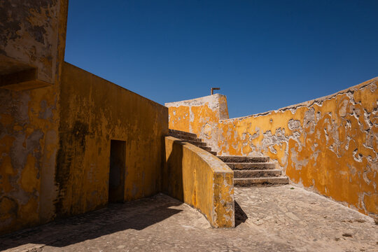 Weathered yellow walls inside Peniche Fortress