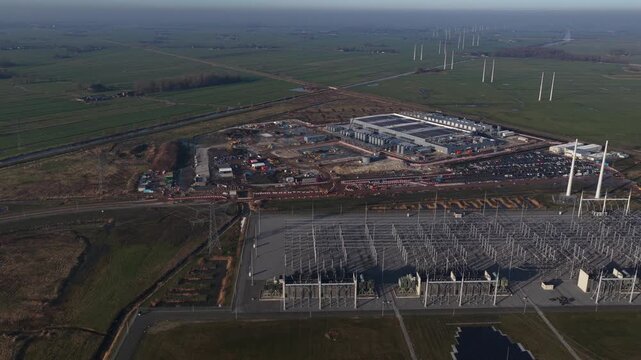 Aerial drone footage of a massive hyperscale data center under construction in Westpoort, Groningen, highlighting extreme electricity consumption, power grid infrastructure, and large scale cloud comp