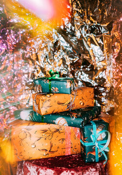 Presents stacked on a table with shiny backdrop