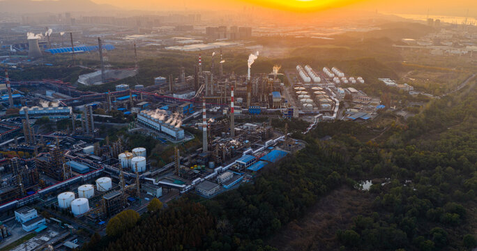 Aerial View of Massive Industrial Plant with Tanks and Pipelines

