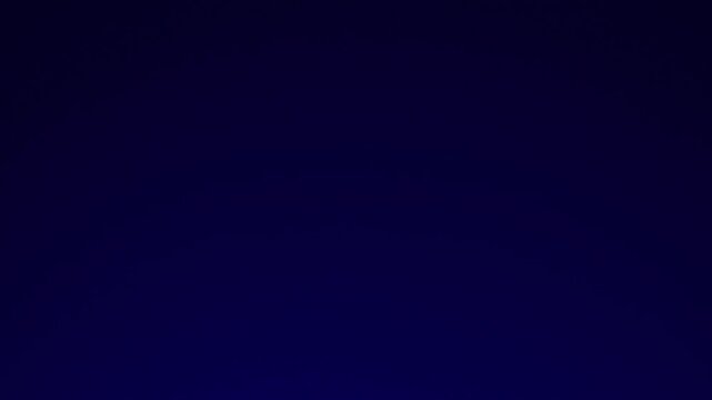 Abstract shot of red and blue police light effects moving across a black background, creating a dramatic glowing visual.