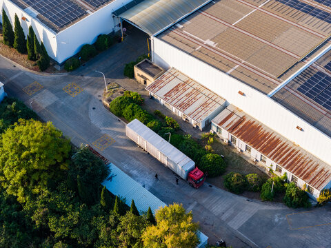 Solar-Powered Factory with Logistics Trucks