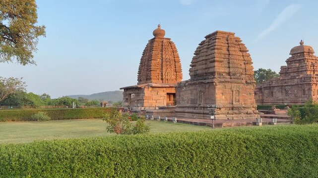 Beautiful Pattadakal stone temples beneath the open sky display timeless architecture, blending Dravidian and Nagara styles with serene historic charm