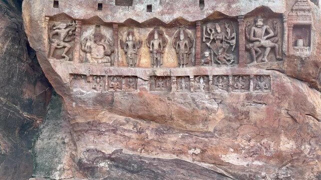 A stunning Dashavatara carved in red sandstone at Badami, showcasing Lord Vishnu&rsquo;s ten incarnations with exquisite detail.