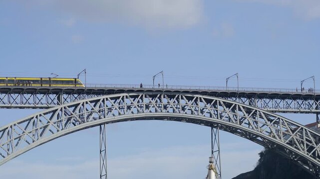 The bridge arch with the metro train crossing on the upper level.