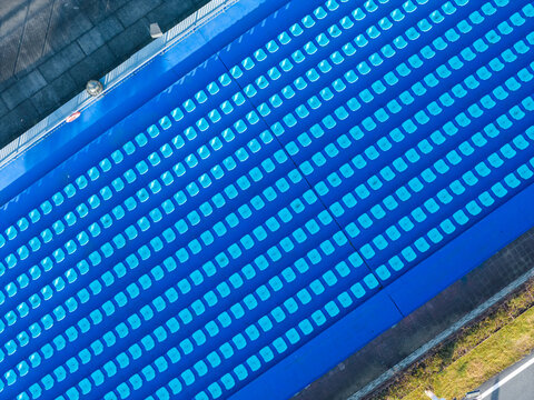 Top-Down View of Blue Stadium Seats in Clean Rows

