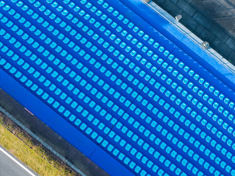 Top-Down View of Blue Stadium Seats in Clean Rows

