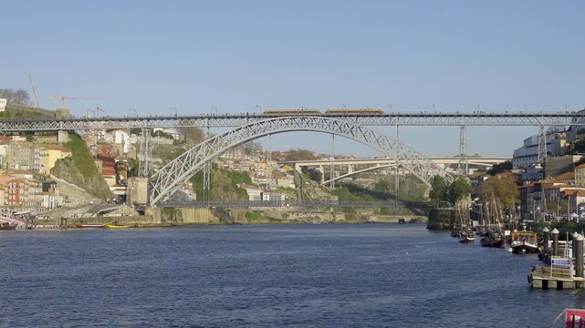 Low angle view of the iron bridge from the river level during the day.