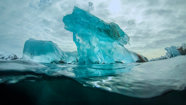 Transparent iceberg ice formation melting and thawing in sea water