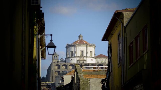 Wide shot through the buildings showcasing the Monastery scale.