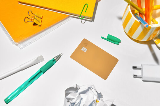 Workspace With Office Supplies and a Credit Card on a Desk