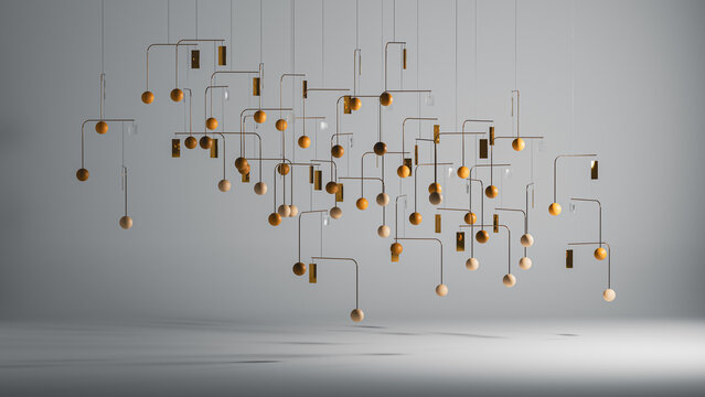 Decorative mobile hangs from the ceiling in modern interior space