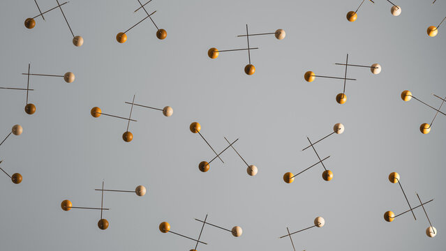 Decorative mobile hangs from the ceiling in modern interior space