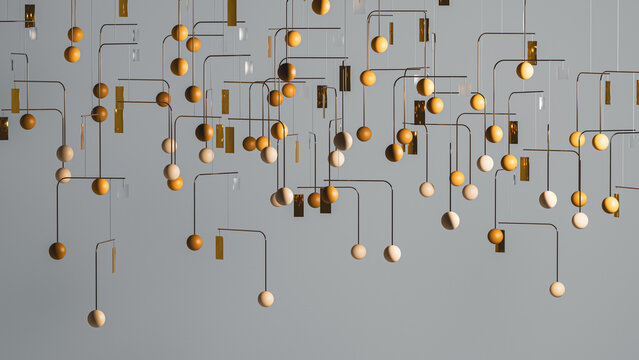 Decorative mobile hangs from the ceiling in modern interior space