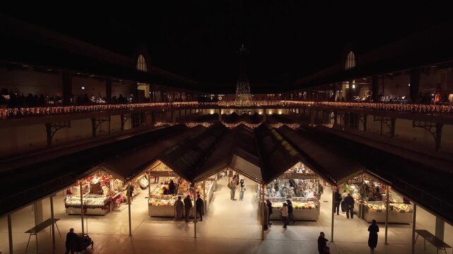 Interior view of Bolhao Market decorated with Christmas stalls.
