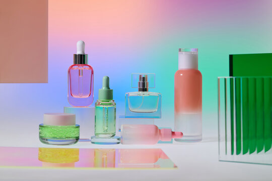 Assortment of elegant skincare and perfume bottles displayed
