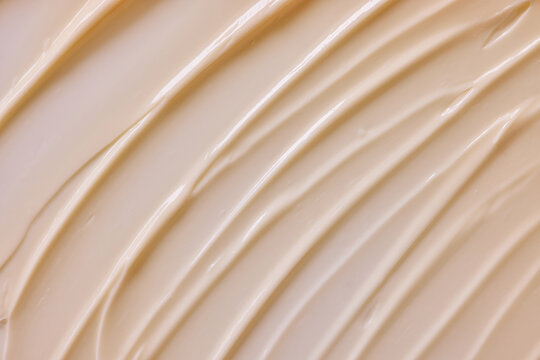 Cream Colored Texture on a Smooth Surface With Lines and Waves
