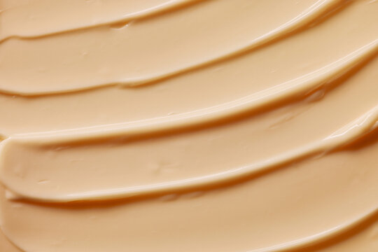 Creamy Layer of Beige Substance Spread on a Flat Surface