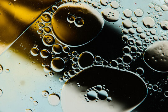 Bubbles and Oil in Liquid on a Flat Surface in a Close View