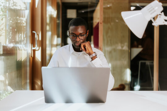 Focused businessman working in modern office