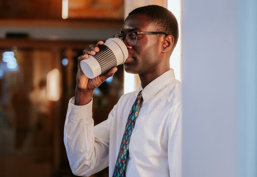 Professional enjoying coffee break in office setting