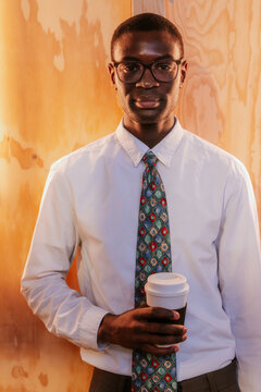 Professional with coffee in office setting