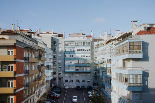 Apartment buildings in Lisbon with parked cars below