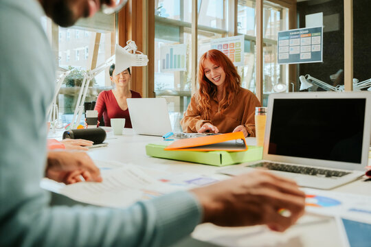 Collaborative office meeting with diverse professionals