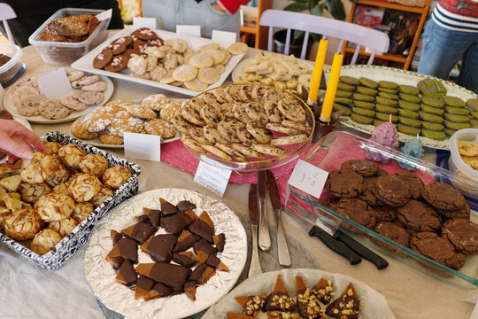 Elaborate spread of Christmas cookies on a large table for exchange