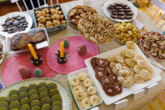 Elaborate spread of Christmas cookies on a large table for exchange