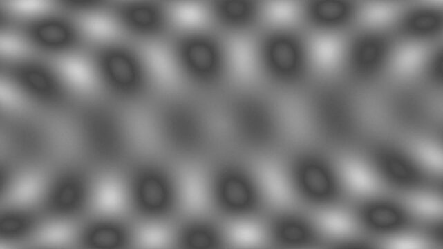 Abstract grey pattern with soft blurred shapes creating a wave-like effect