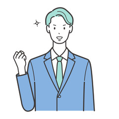 ガッツポーズで正面を向いたスーツの男性