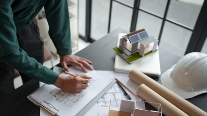 Architecture Man drawing on architectural Creative project business architecture building construction&nbsp;Industrial engineering Achievement Planning Design on eco blueprint