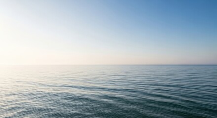 Obraz premium Serene ocean water with gentle ripples reflecting blue sky and soothing light for calming atmosphere and peaceful relaxation experience always.