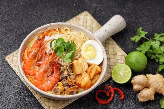 Laksa is a spicy noodle soup popular in the Peranakan cuisine of Southeast Asia. Laksa consists of thick wheat noodles or rice vermicelli with chicken, prawn or fish, served in spicy soup.