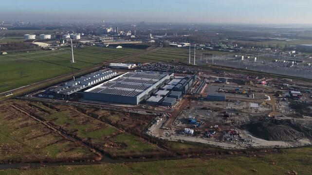 Aerial drone footage of a new data center under construction in Groningen Westpoort, highlighting big data processing, high performance computing, server infrastructure, and cloud technology.