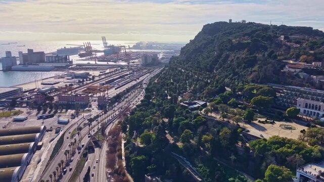 Amazing drone view of Montjuic or Montjuich aka Jewish Mountain and local infrastructural port area, Barcelona, Spain