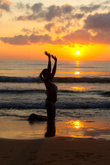 Fototapeta premium Woman in bikini exercise and sunrise