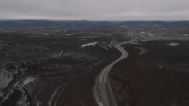 Aerial view of a highway entering Scranton, Pennsylvania. Shot on an overcast day.