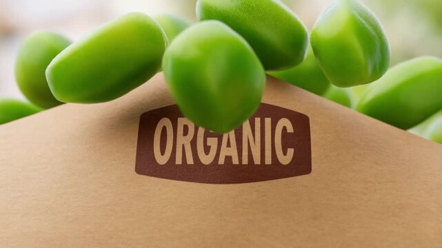 Slow motion of peas falling against a blurred background in front of a focused organic label on a bag concept for direct organic product branding and promotion
