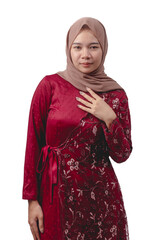 Young asian woman wearing elegant red dress and hijab for cultural celebration