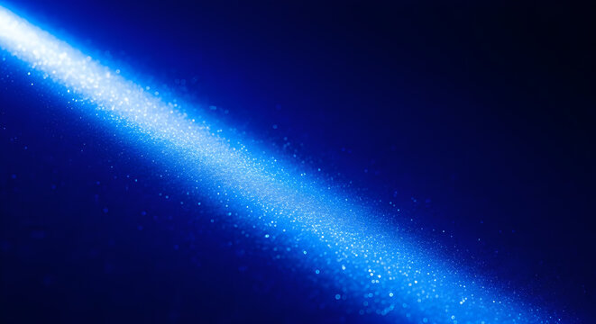 Sparkling blue light beam on dark blue background with glittering effect and white highlights shining brightly across