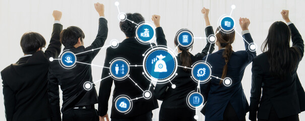 A group of business professionals stands with raised fists, symbolizing teamwork and determination, surrounded by financial and strategic icons in a modern office setting. Amity © InfiniteFlow