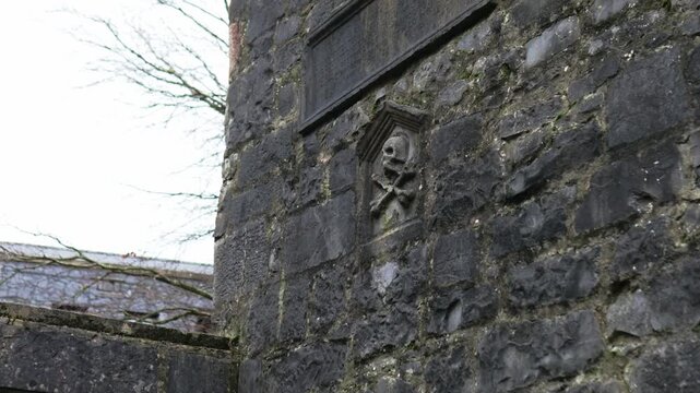 Exterior wall of the Lynch Memorial Window in Galway City, a medieval monument built with limestone masonry and Gothic architectural details