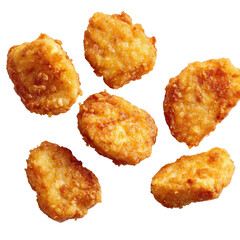 Six golden-brown, bite-sized, crispy fried chicken nuggets scattered on black backdrop